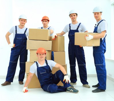 Professional packers preparing household boxes for a Richmond move