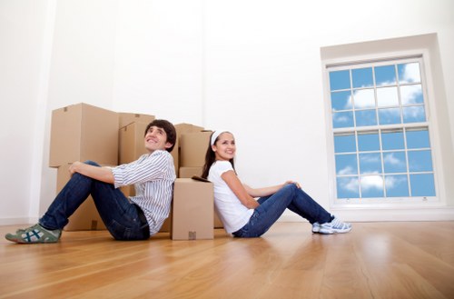 Removal crew handling furniture in a Richmond property